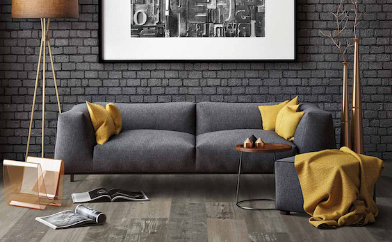 wide planked wood look luxury vinyl flooring in a grey monochromatic living room